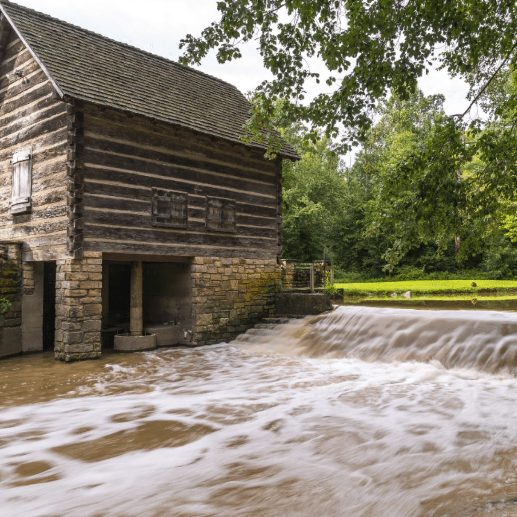 water rushing next to a cabin